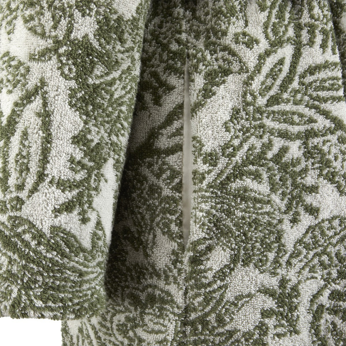 A close-up of Yves Delorme Patio bath robe showing a pocket opening