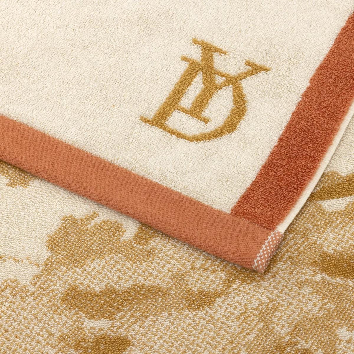 Closeup of Yves Delorme Rive Beach Towel in Sable color