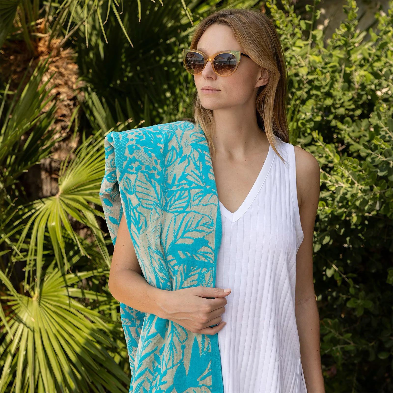 Model with Yves Delorme Sao Beach Towels in Lagon