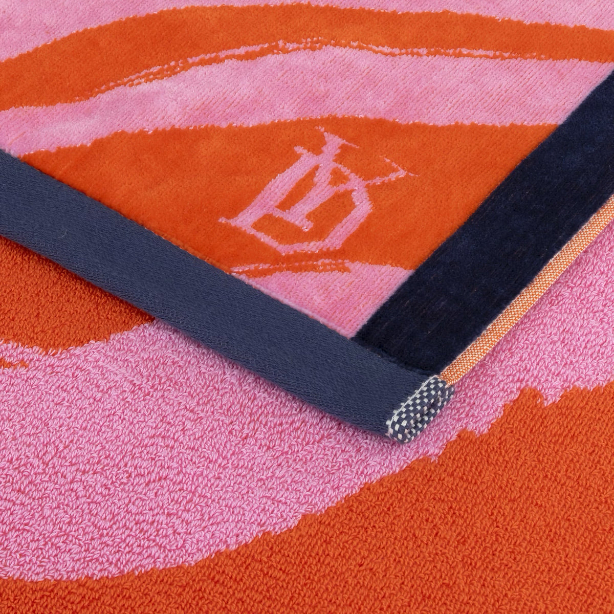 A close-up of Pivoine Yves Delorme Solaire Beach Towel, made in France.