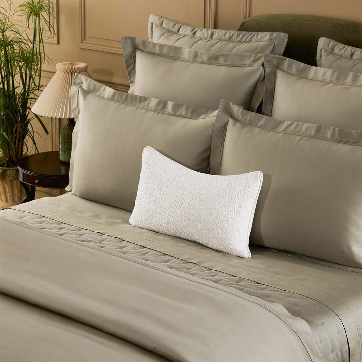 Closeup of Yves Delorme Triomphe bedding in Kaki color