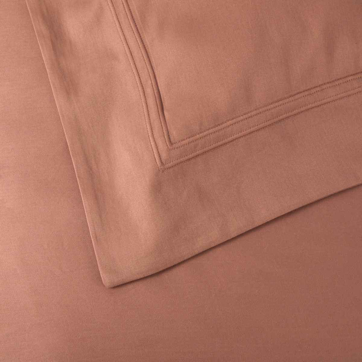 Shams and Pillows Detail of Yves Delorme Triomphe Bedding in Sienna Color