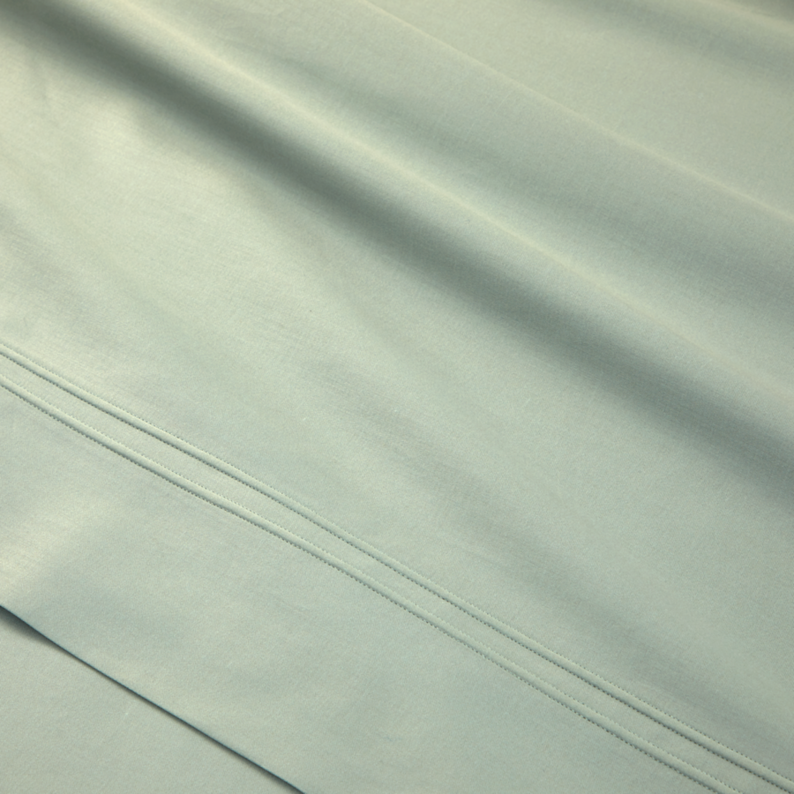 Stack of Yves Delorme Triomphe Sheet Set in Veronese Color