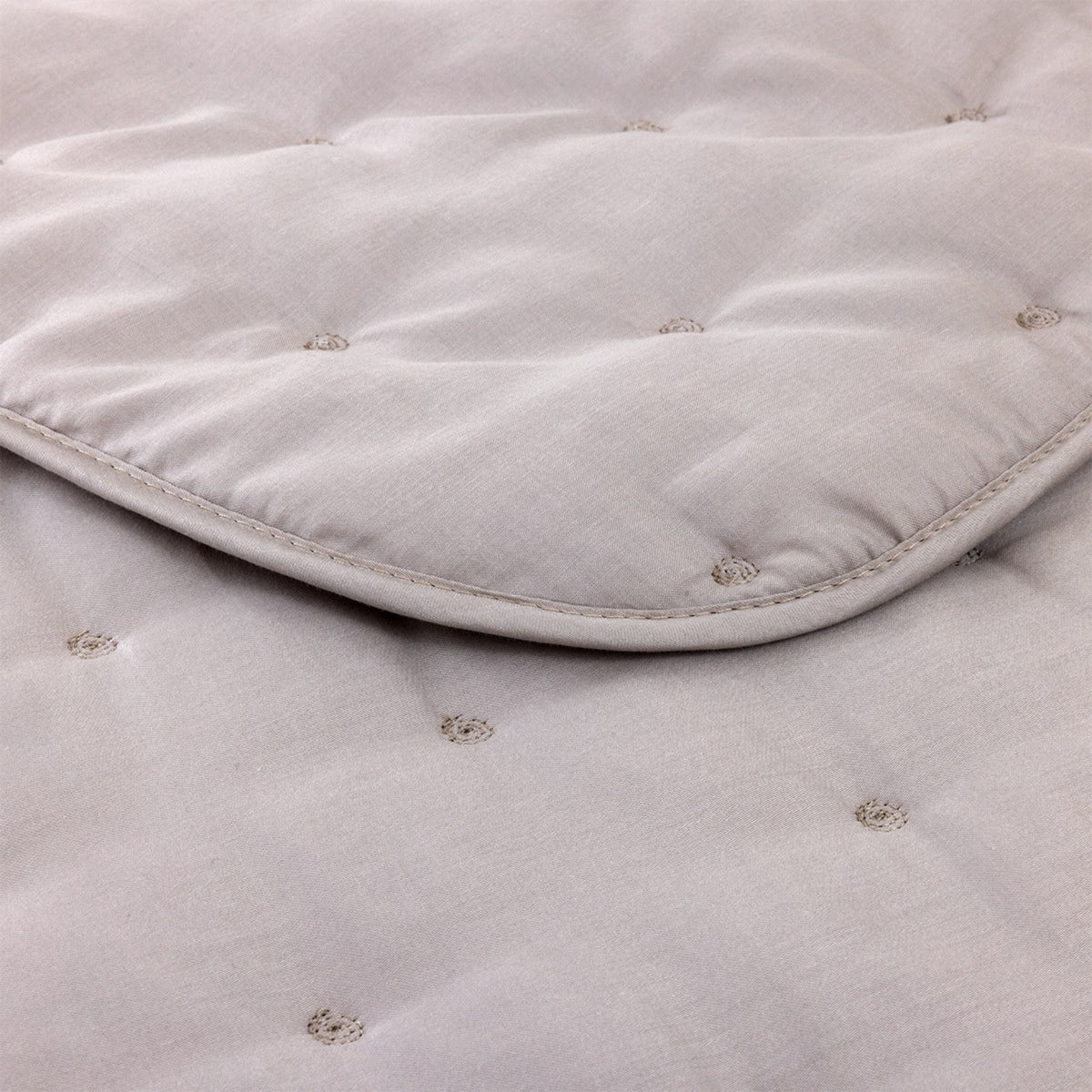 Closeup of Yves Delorme Triomphe Quilted Bedding in Loutre color