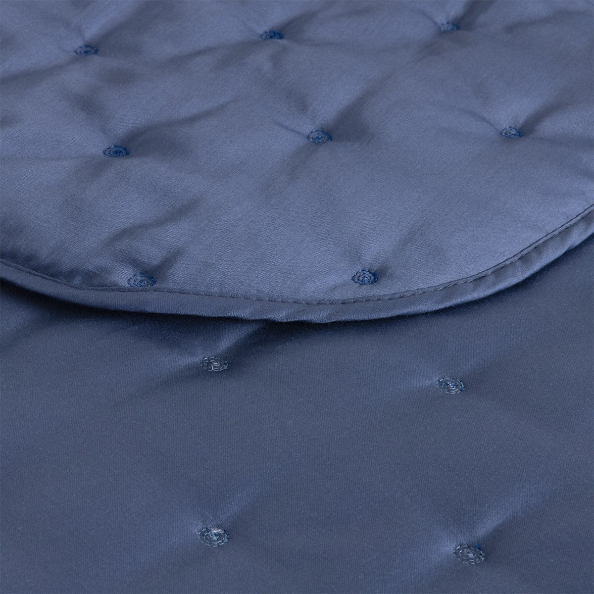 Closeup of Yves Delorme Triomphe Quilted Bedding in Outremer color