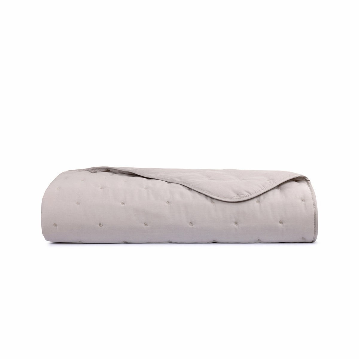 Folded Yves Delorme Triomphe Quilted Counterpane Sham in Loutre color