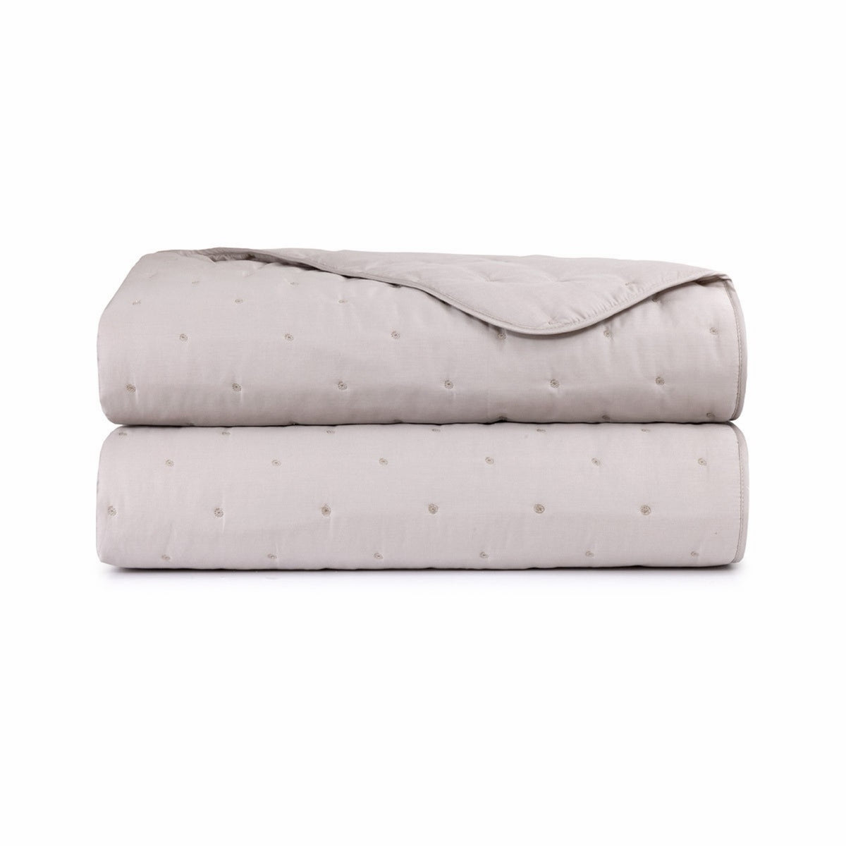 Folded Yves Delorme Triomphe Quilted Coverlet in Loutre color