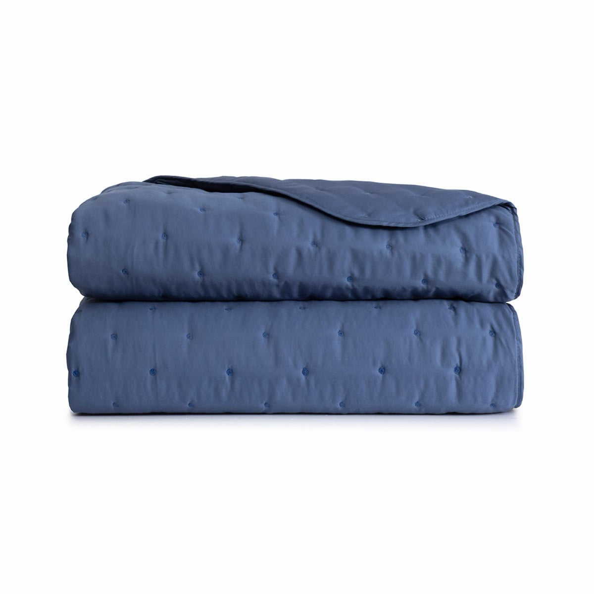 Folded Yves Delorme Triomphe Quilted Coverlet in Outremer color
