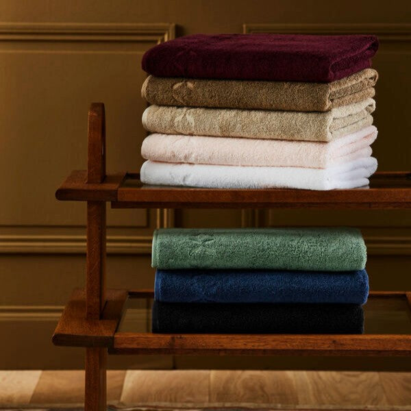 A stack of folded Yves Delorme Nature towels