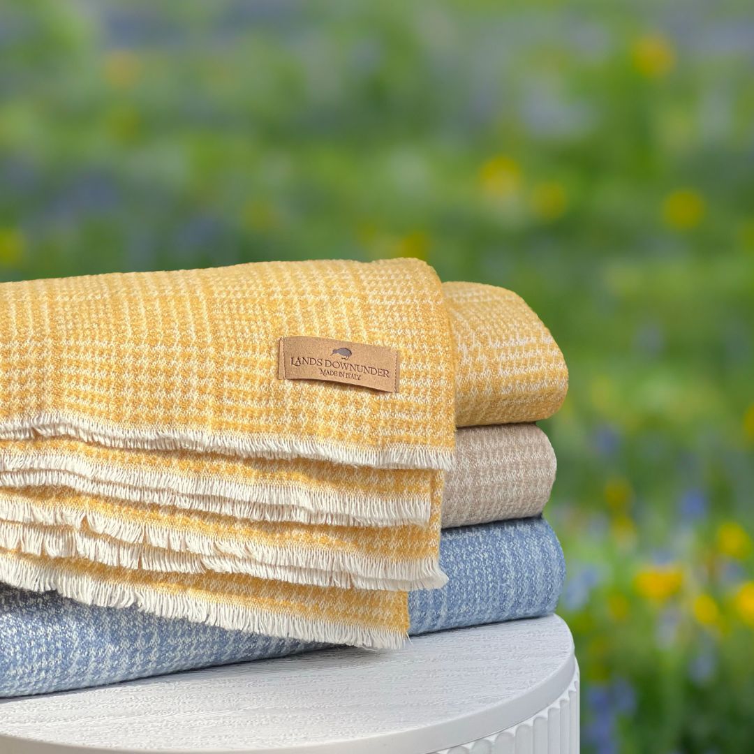 Stack of Lands Downunder Hudson Valley Throws with the Cider color at the forefront