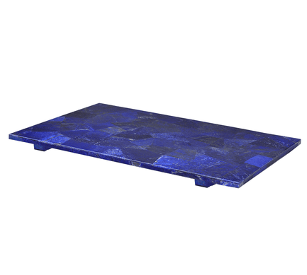 A rectangular blue stone slab with short feet, perfect for luxury bathroom decor and featuring a patchwork pattern.