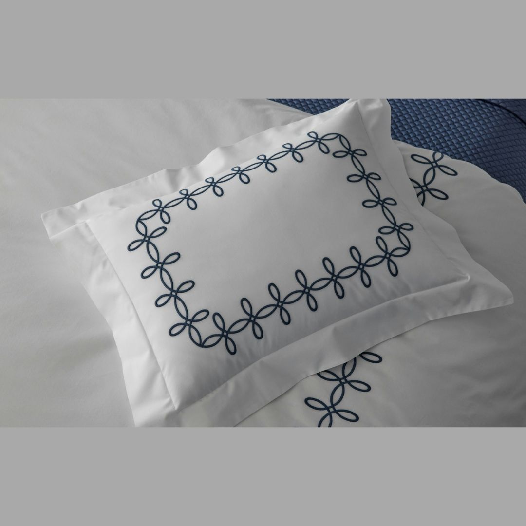 Close up of Gordian Knot sham and duvet cover in Baltic