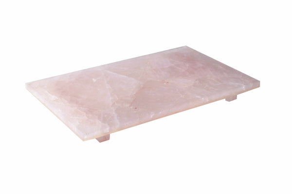Rectangular Taj Premium Gemstone rose quartz slab with a smooth surface, set on small feet, against a white background.