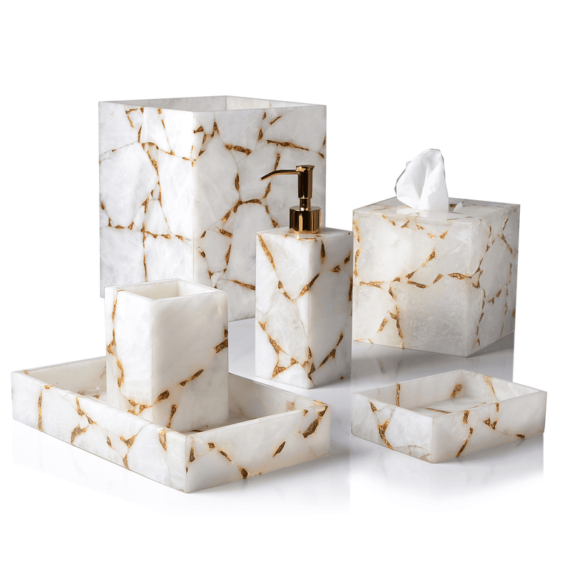 Five white and gold foil bath accessories, including trays, tissue box, soap dispenser, and toothbrush holder.