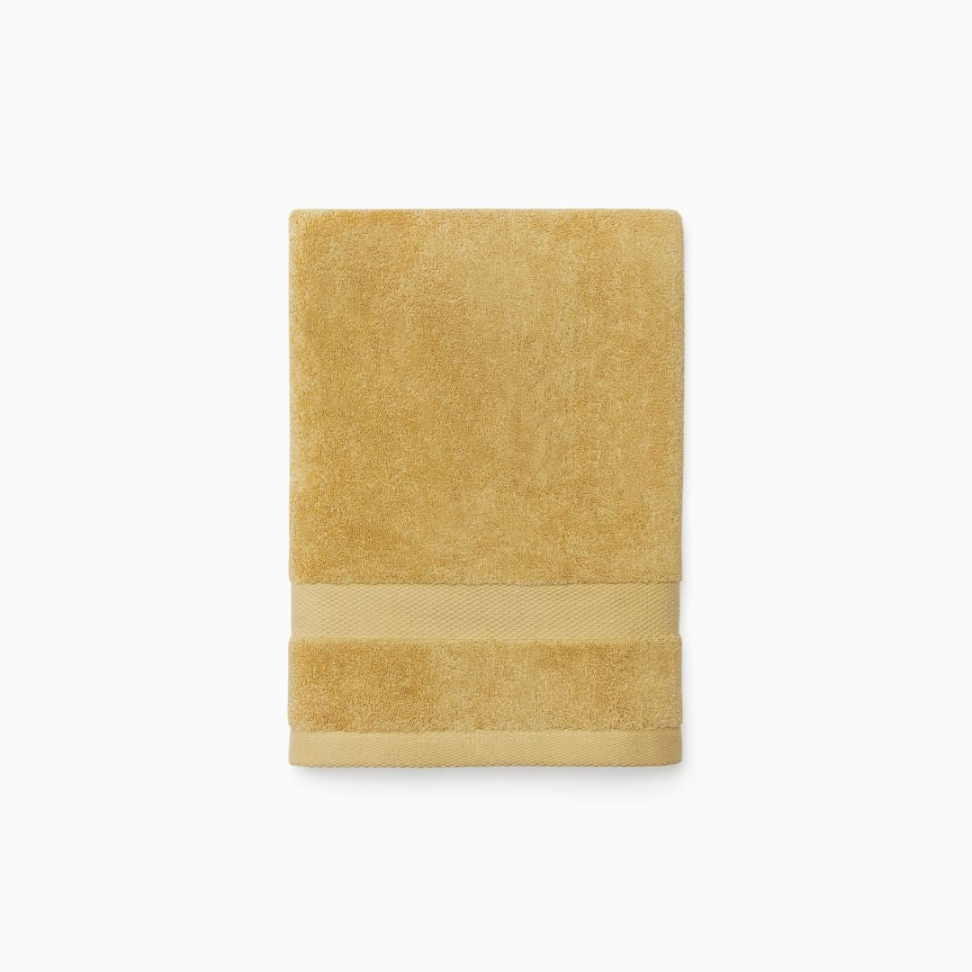 A neatly folded Sferra Bello Nuovo Towel, made of long-staple combed cotton, rests on a plain white background.