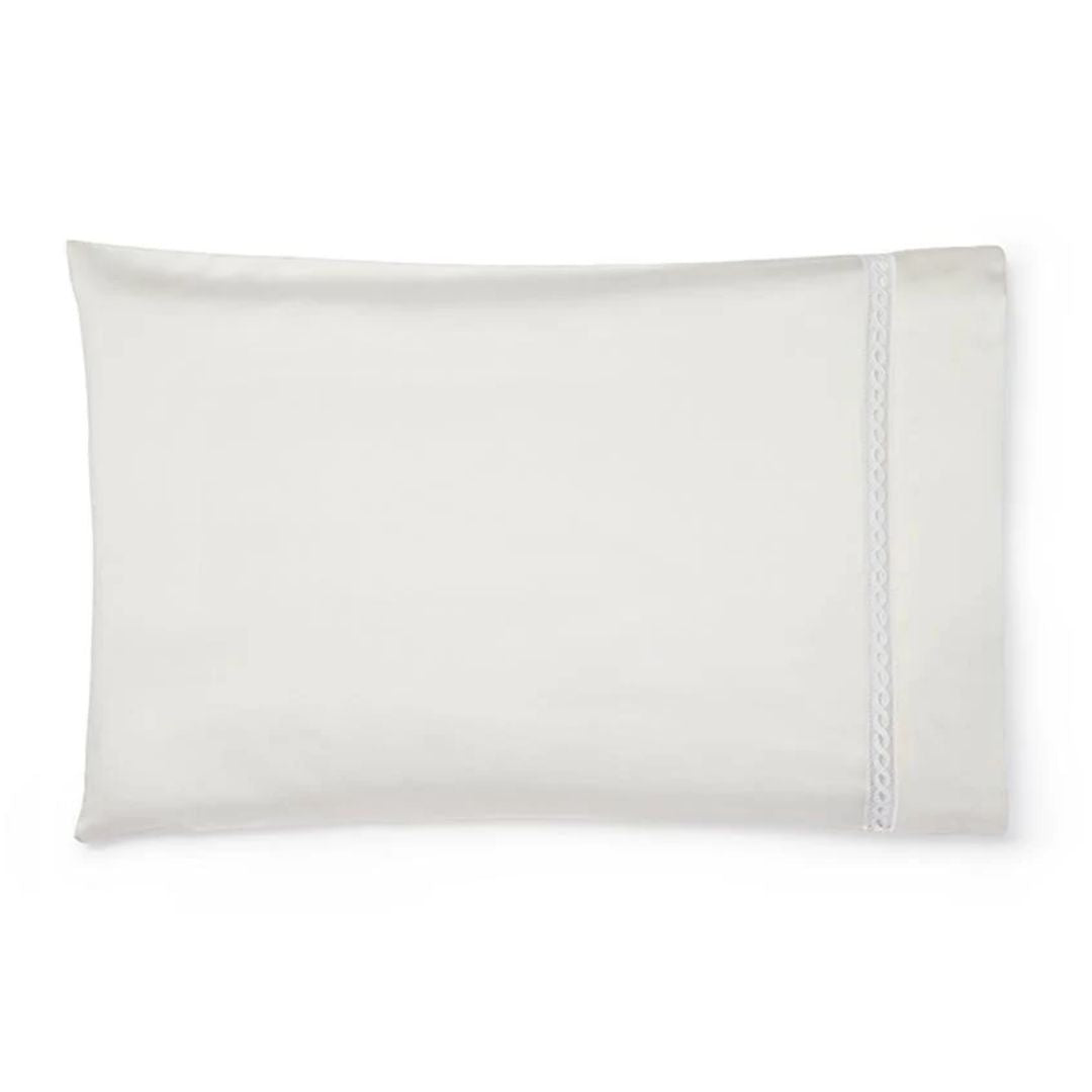 A white pillowcase with a simple trim, crafted to pair perfectly with Sferra Millesimo luxury Egyptian cotton sheets.