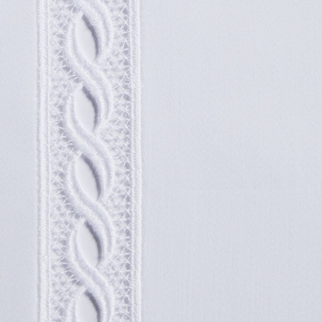 White fabric with a vertical panel featuring a twisted, braided pattern, inspired by Sferra Millesimo bedding.