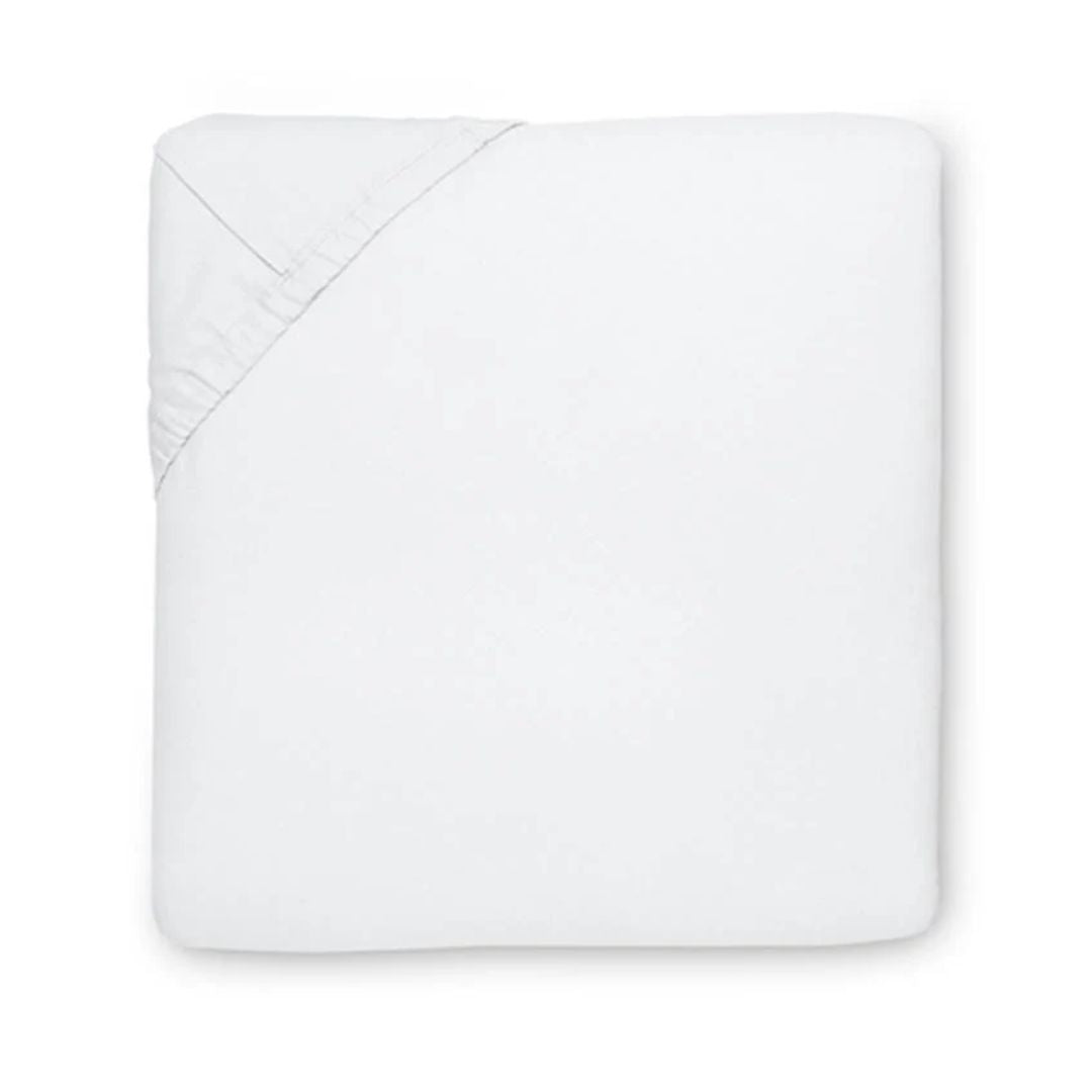 A neatly folded white Egyptian cotton sheet with one corner turned up to show the elastic edge.