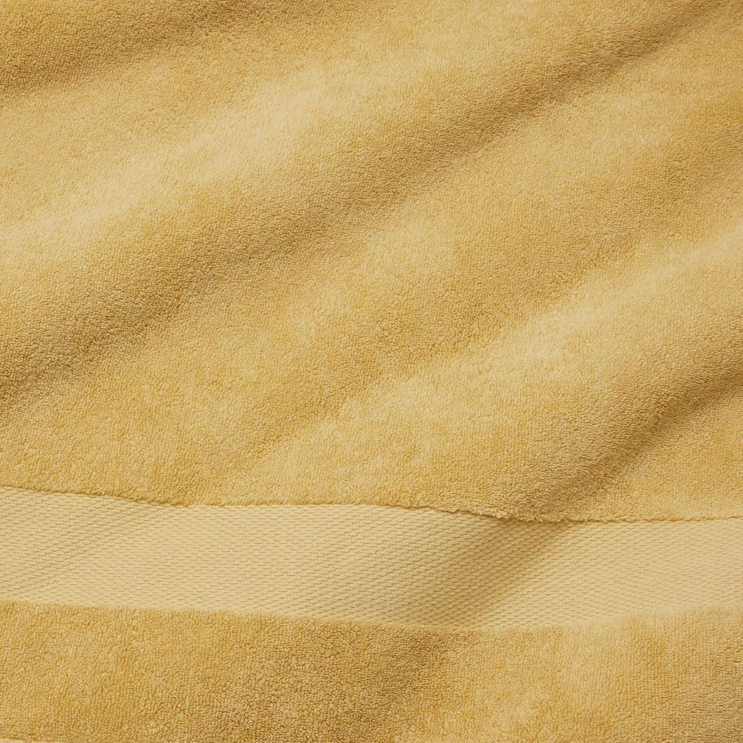 Close-up of a fade-resistant towel made from long-staple combed cotton, featuring a smooth woven band across it.
