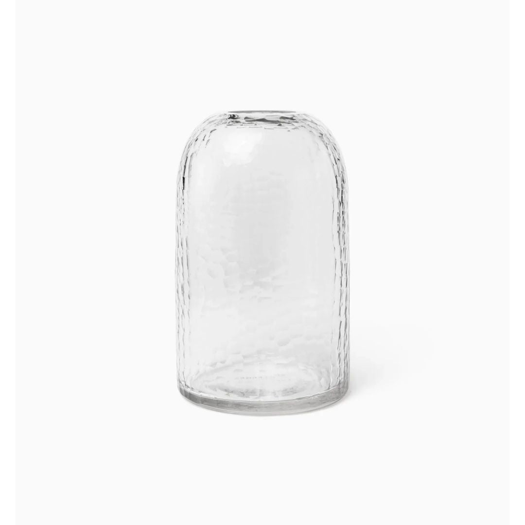 Clear, hand cut glass vase with a rounded top and cylindrical shape, set against a plain white background.