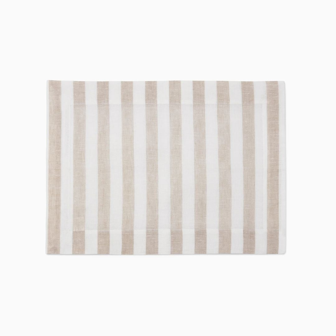 Rectangular placemat with vertical beige and white stripes, perfect for coastal table decor.