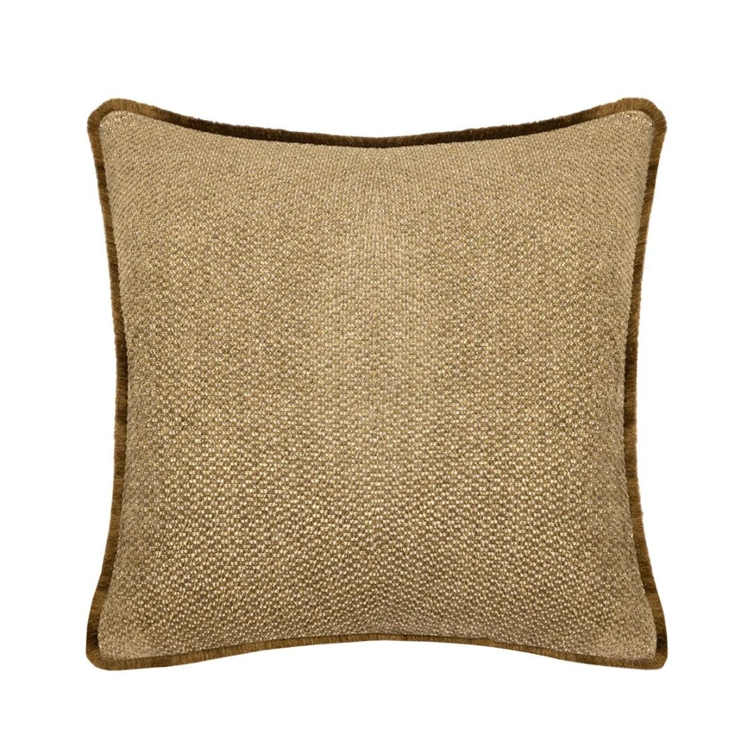 Square Yves Delorme Aura decorative pillow in a textured gold fabric with dark brown piping.