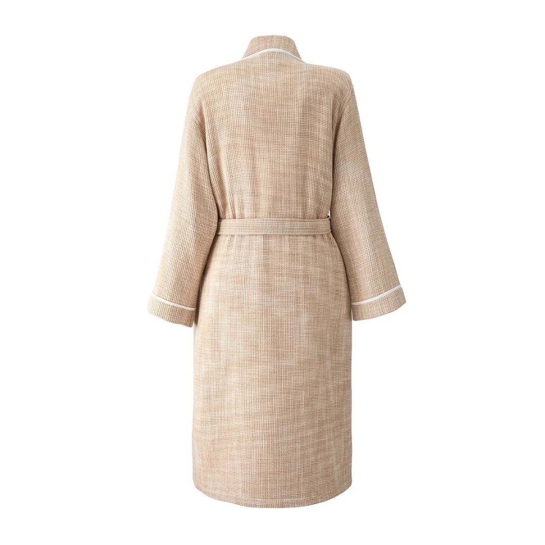Back view of a tan honeycomb bathrobe with white piping.