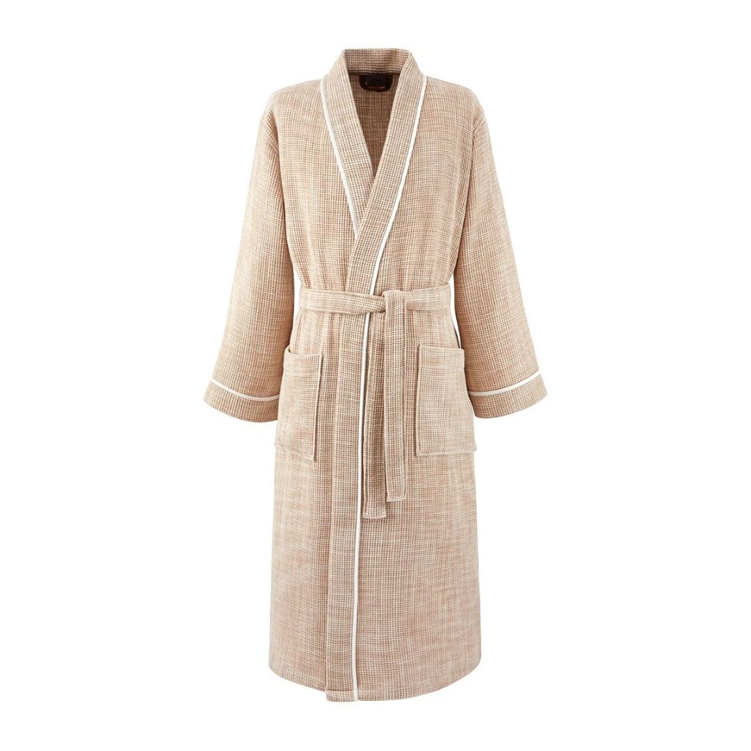 Tan honeycomb cotton bathrobe with white piping and a tie belt.