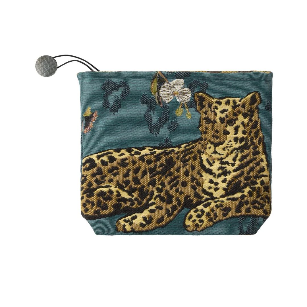Teal Yves Delorme Orchidia decorative pillow pouch with a woven leopard and floral pattern and a circular toggle pull.