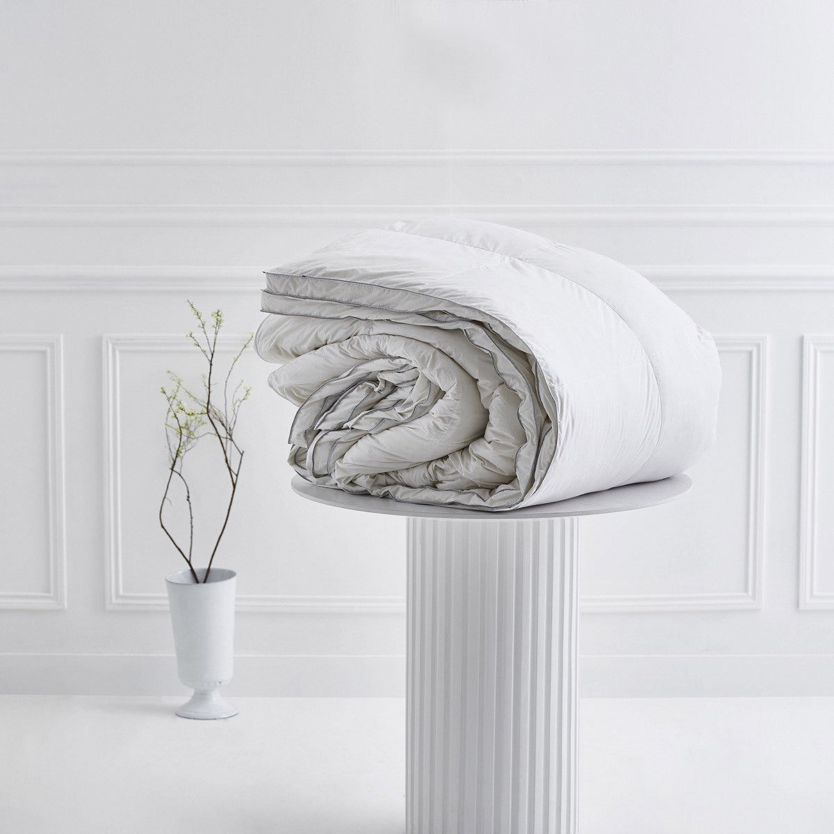 Yves Delorme Prestige Winter Comforter on a pedestal 