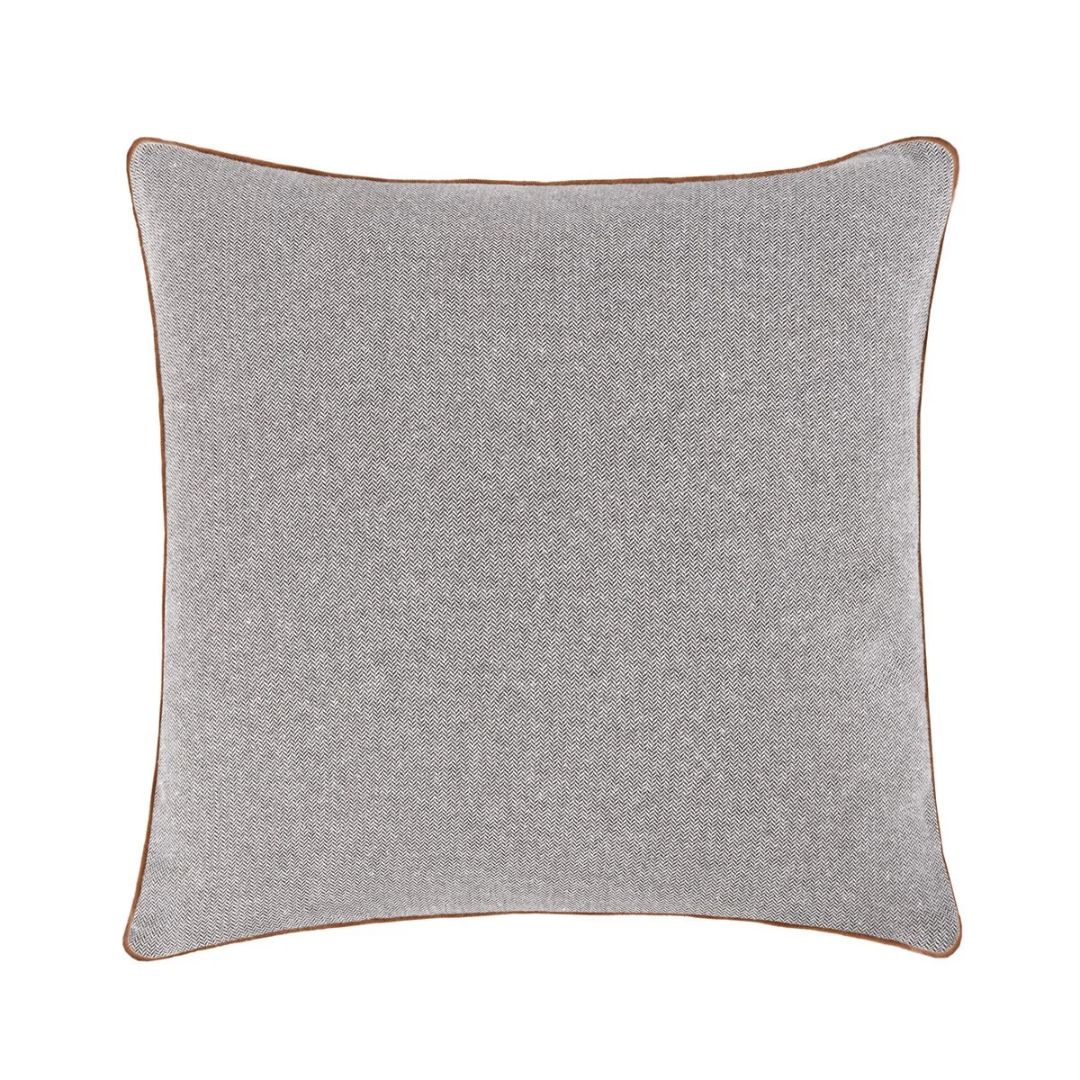 Square gray herringbone Yves Delorme Charlies decorative pillow with brown piping.