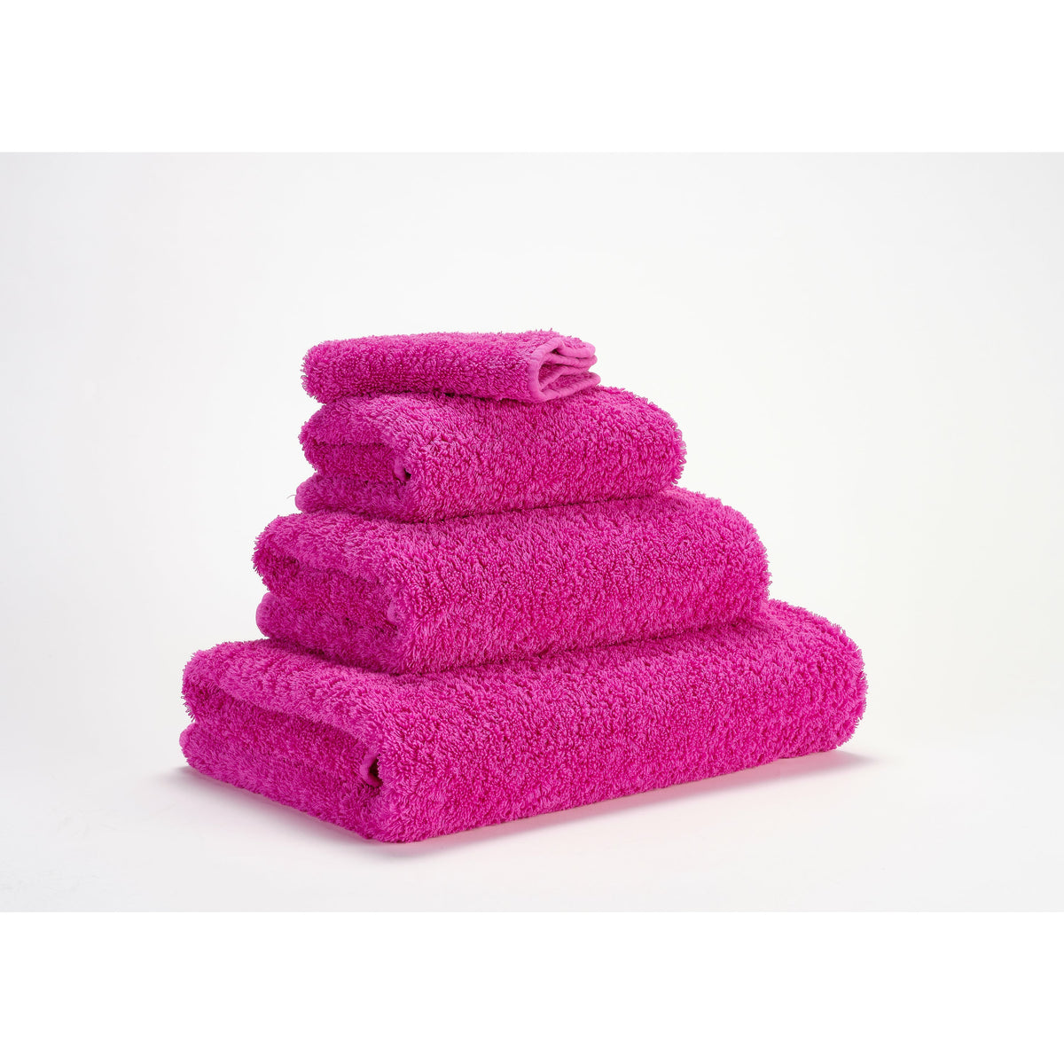 Abyss Super Pile Bath Towels Happy Pink Fine Linens Stack Slanted