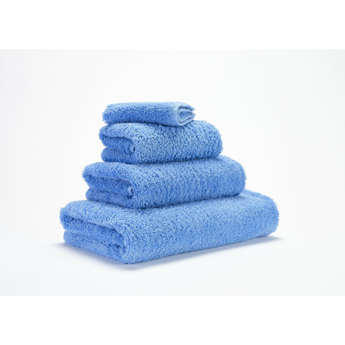 Abyss Super Pile Bath Towels Regatta Fine Linens Stack Slanted