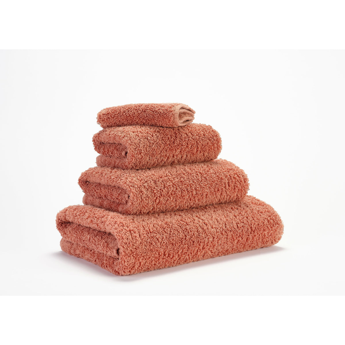 Abyss Super Pile Bath Towels Terracotta Fine Linens Stack Slanted
