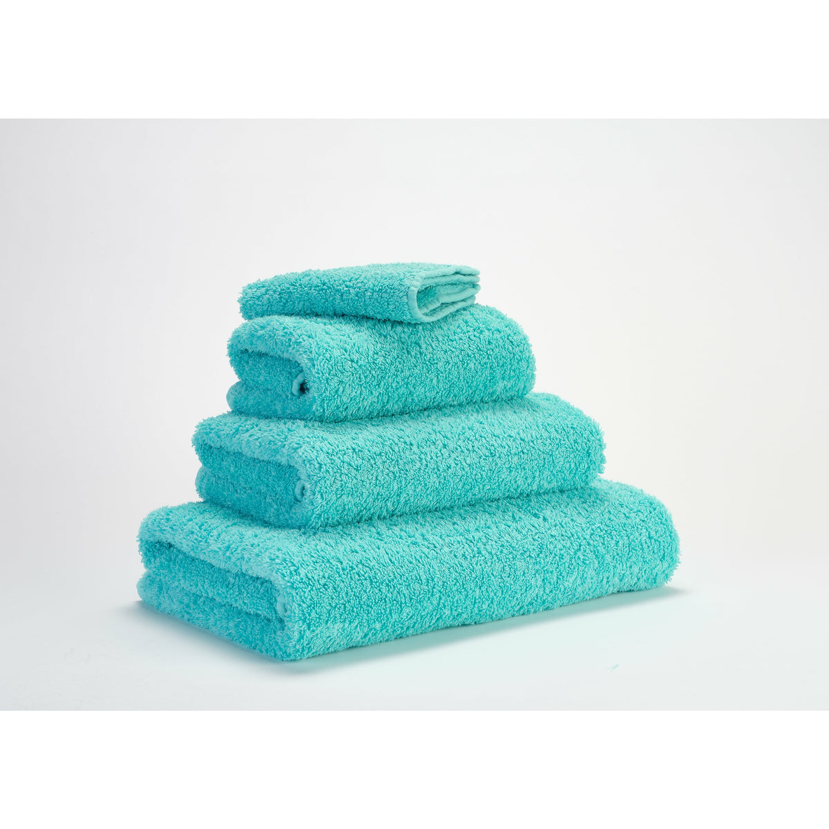 Abyss Super Pile Bath Towels Turquoise Fine Linens Stack Slanted
