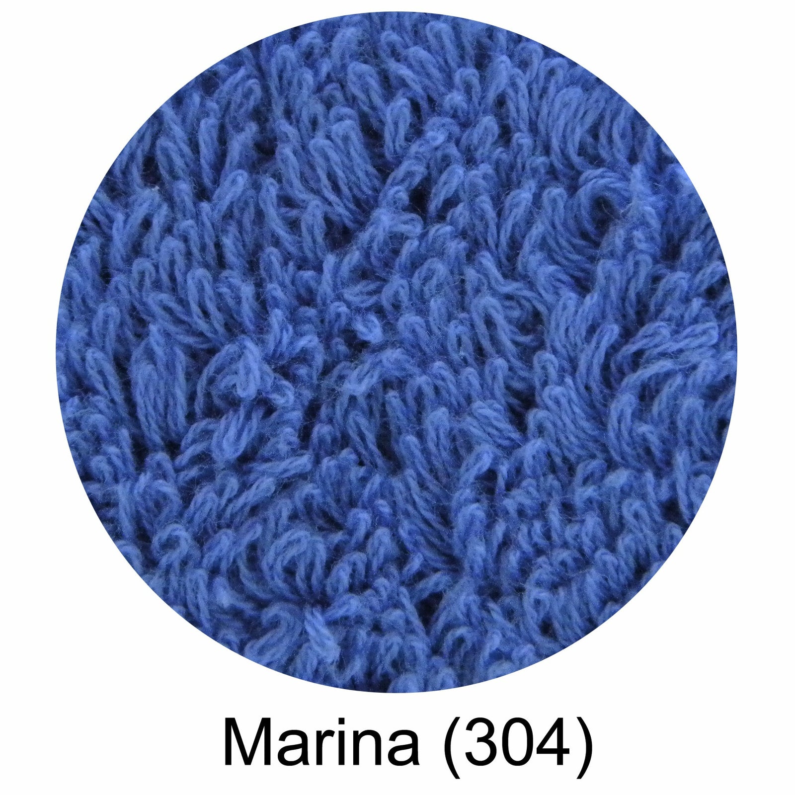 A blue Abyss Ocean Beach Towel laid out on the sand at the beach with the brand 'ABYSS' visible on the towel.