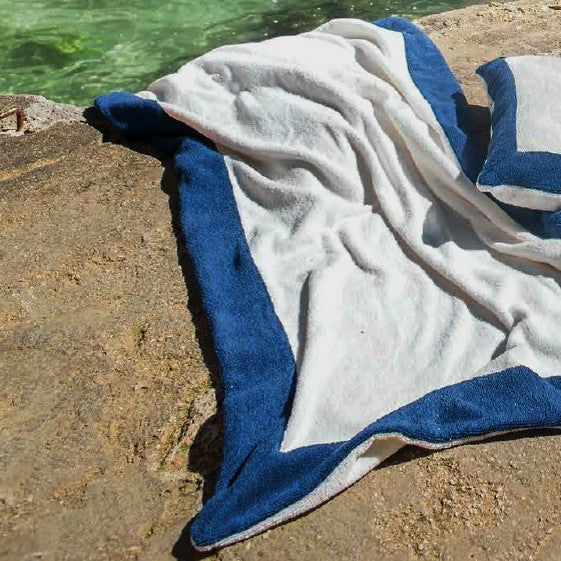 Abyss Habidecor Portofino Beach Towels and Pillows On Rock Fine Linens