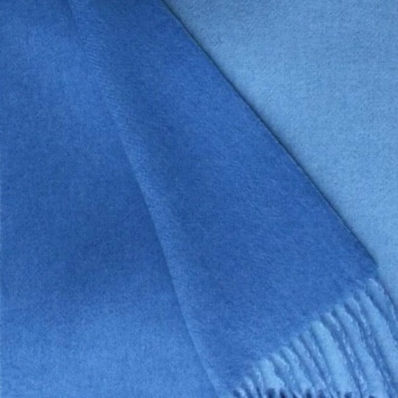Lifestyle Image of Alashan Double Faced Classic Cashmere Blend Throw Carolina Blue/Bay Blue Color