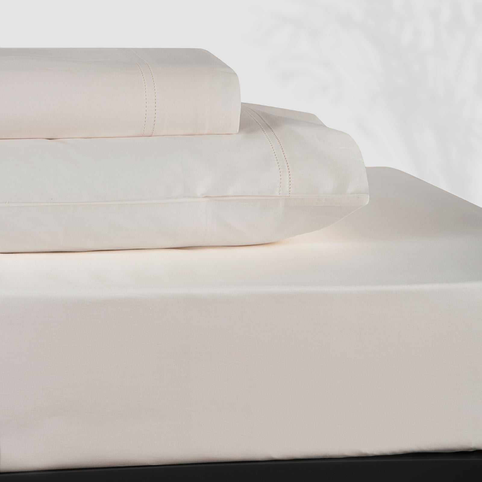 Stack of BOVI Simply Sateen Bedding Sheet Set Ivory