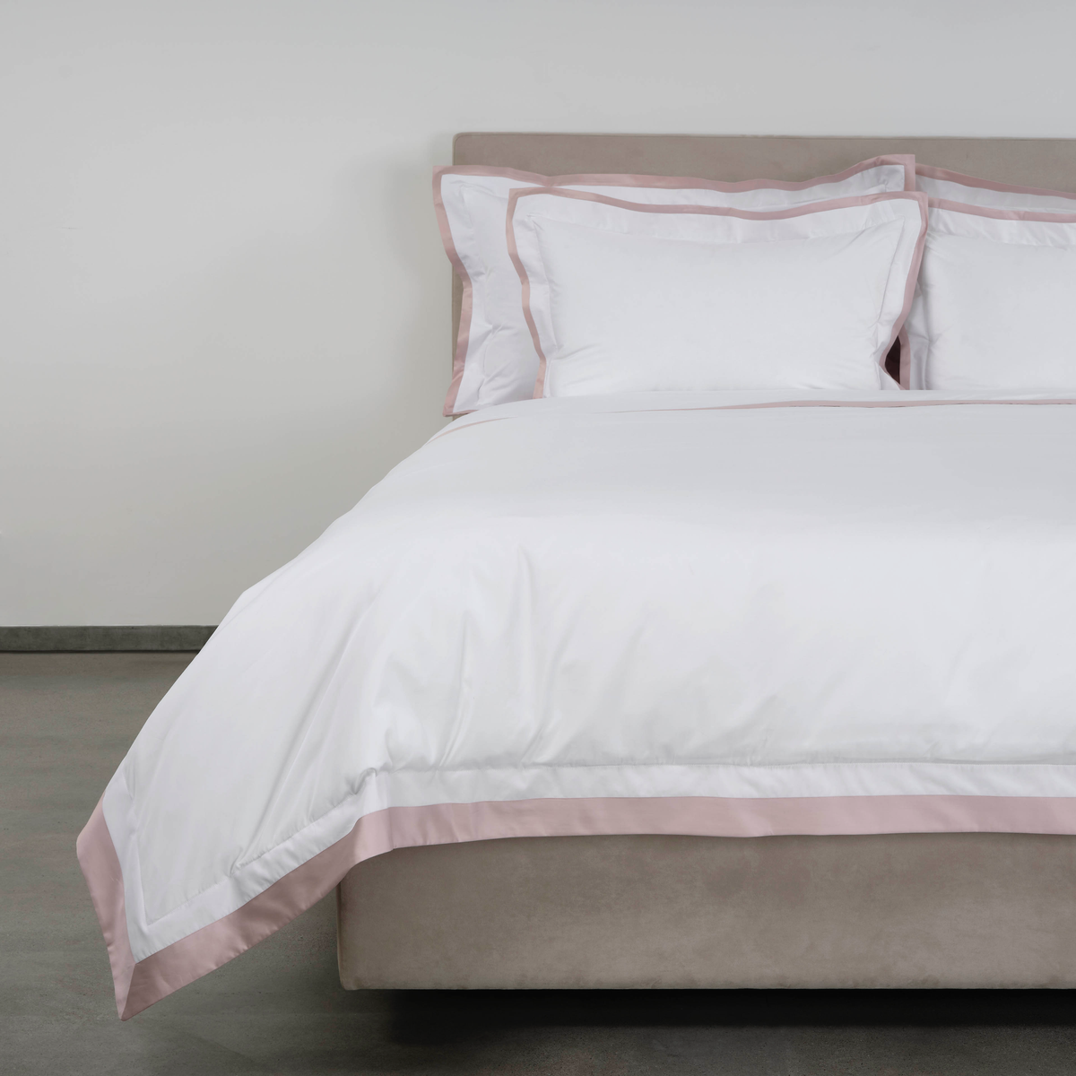 Corner View of Full Bed Dressed in Celso de Lemos Hella Bedding in Nuage Rose Color