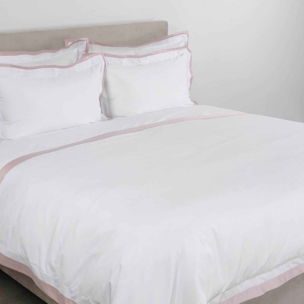 Side View of Full Bed Dressed in Celso de Lemos Hella Bedding in Nuage Rose Color
