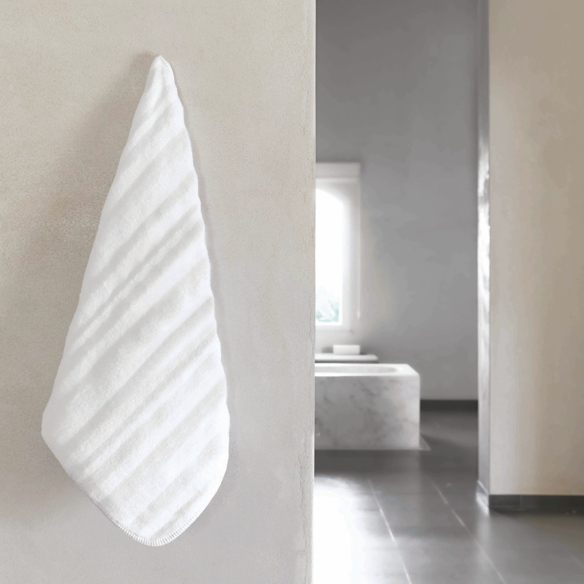 White Graccioza Alentejo Bath Towel Hangging on a Wall