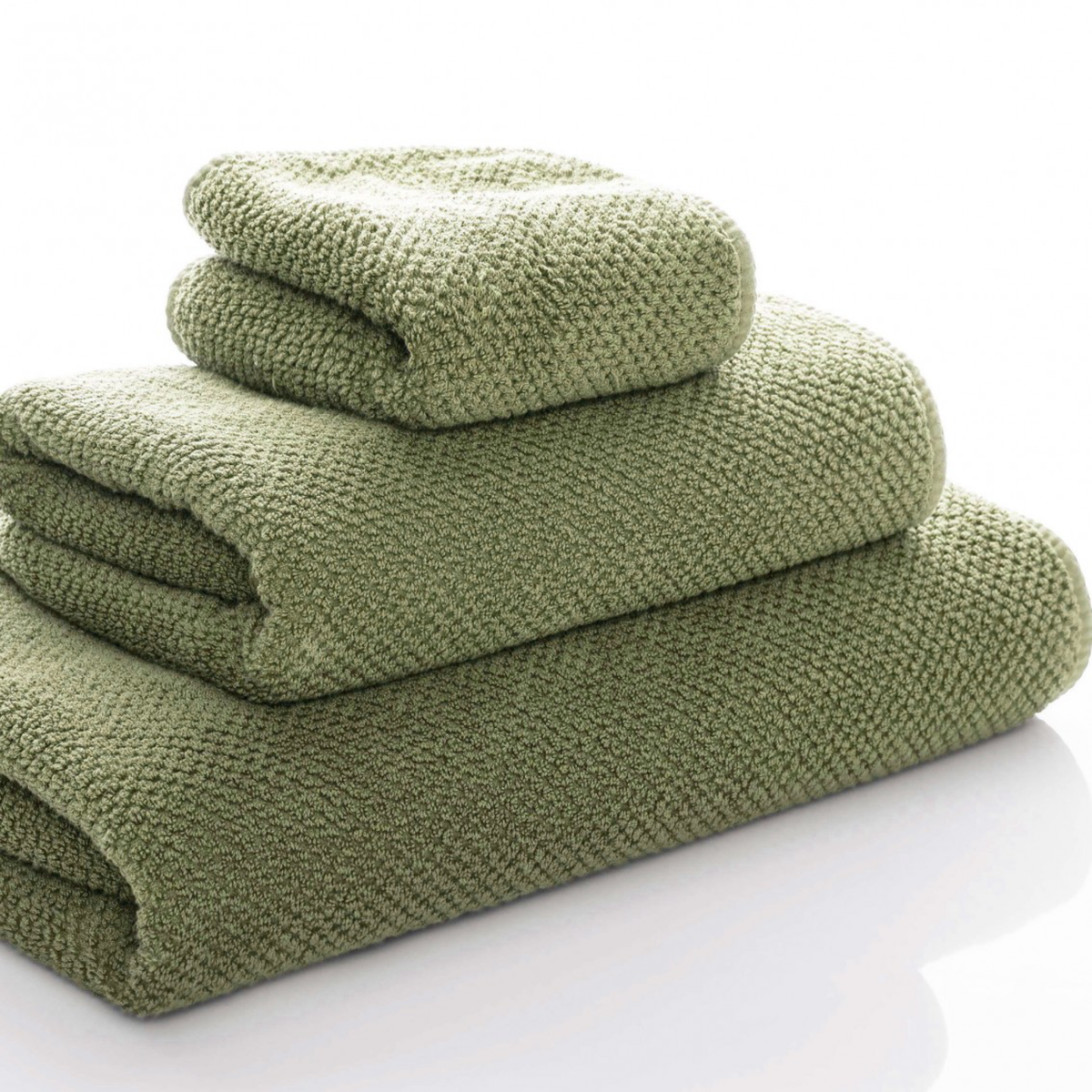 Side Angle of Stack of Graccioza Bee Waffle Towels in Jade Color and Different Sizes
