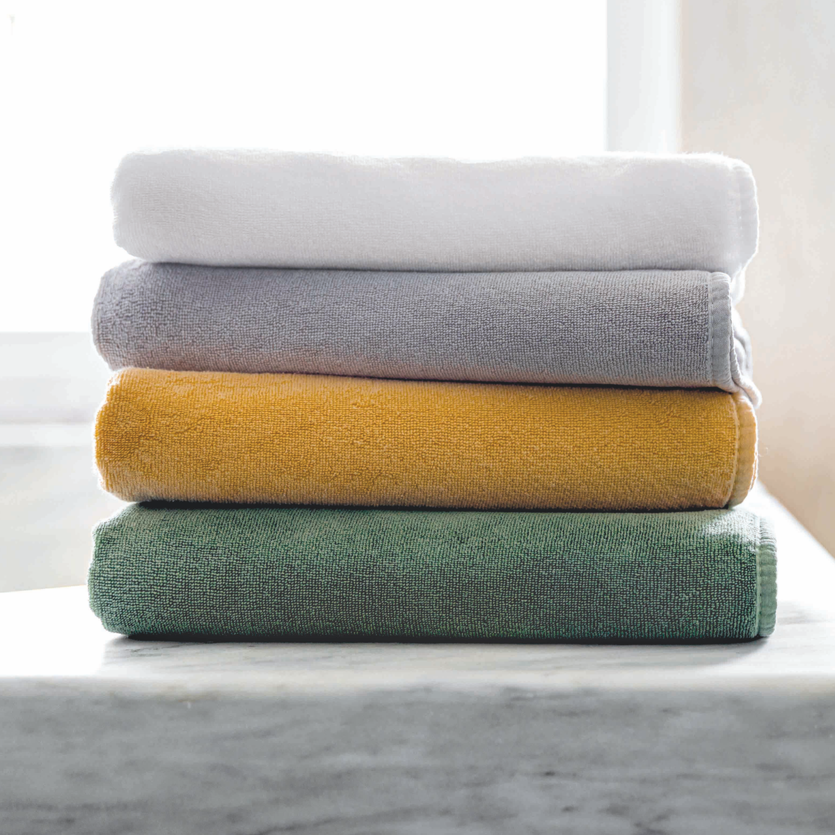 Stack of Graccioza Cool Bath Towels in Different Colors