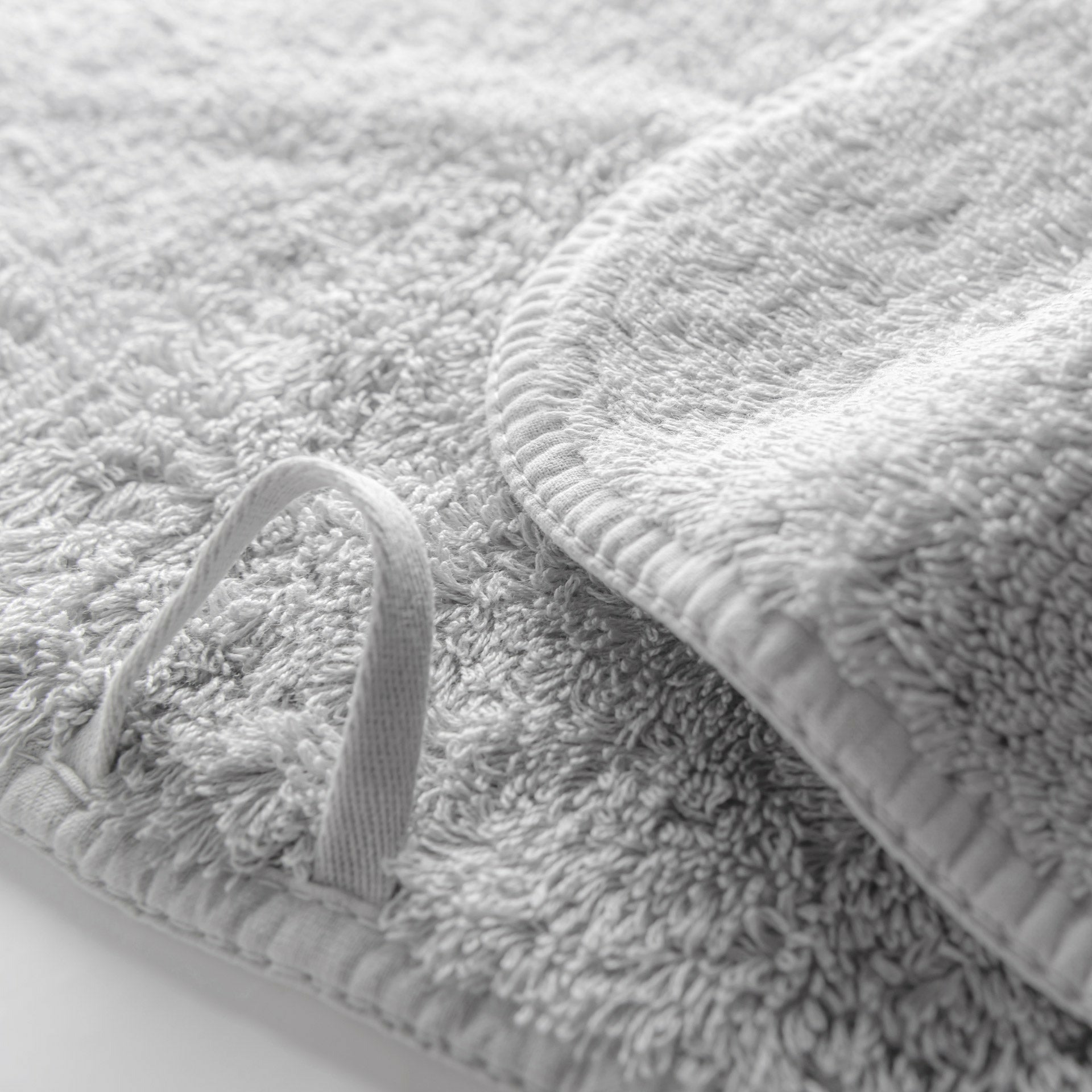 https://flandb.com/cdn/shop/products/Graccioza-Long-Double-Loop-Bath-Towels-Closeup-Silver_5000x.jpg?v=1660862692