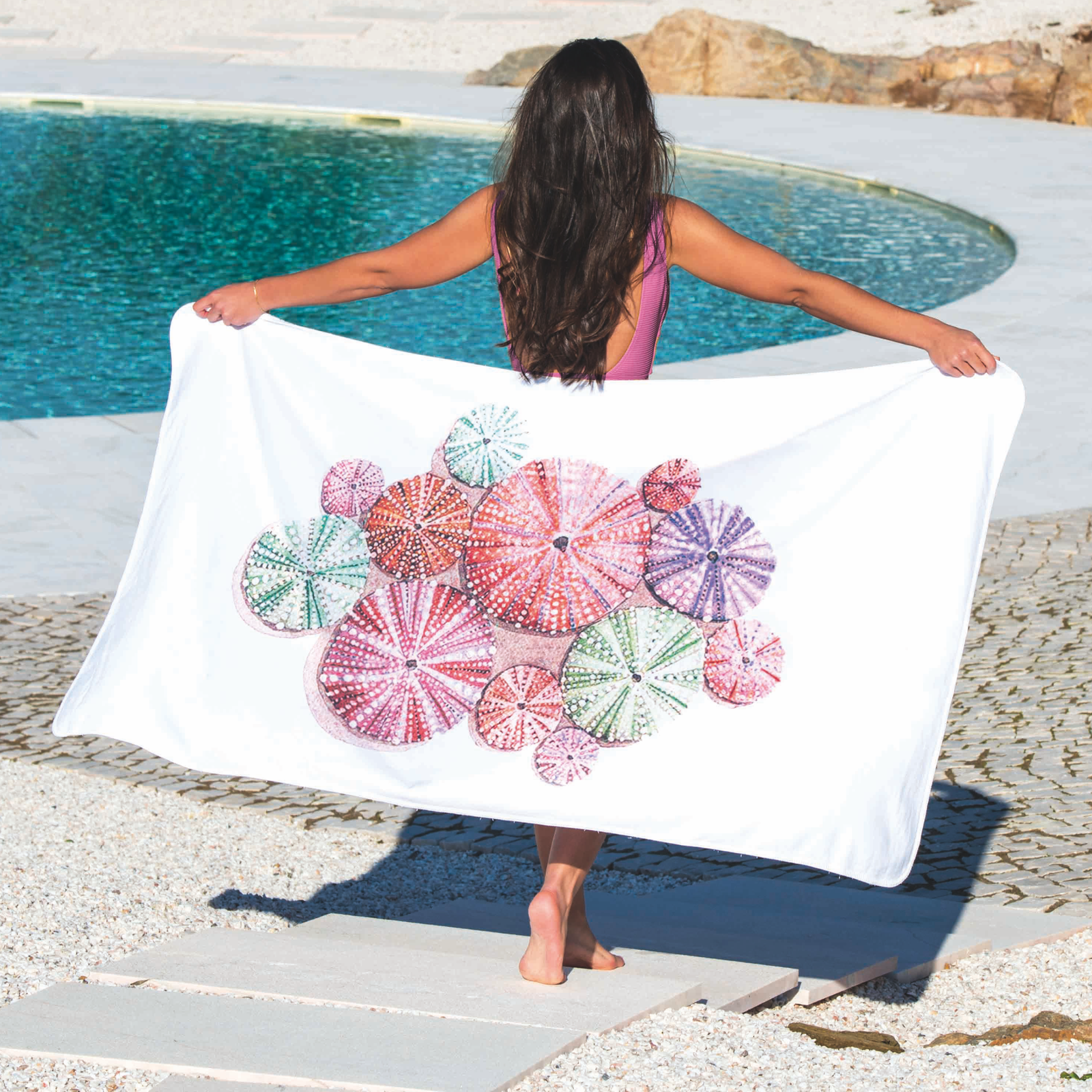 Woman with Graccioza Urchin Beach Towel Beside a Pool