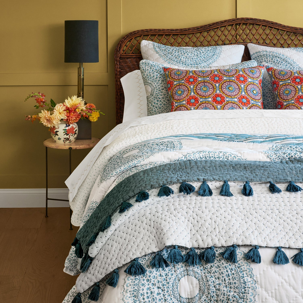 Closeup of  Combination of John Robshaw Lapis Quilt and Shams Peacock Color with Other Bedding Collections