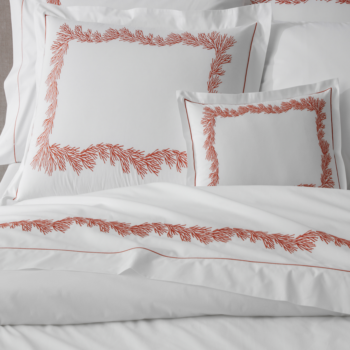 Lifestyle Detailed Image of Matouk Atoll Bedding Collection with Swatch of Hacienda