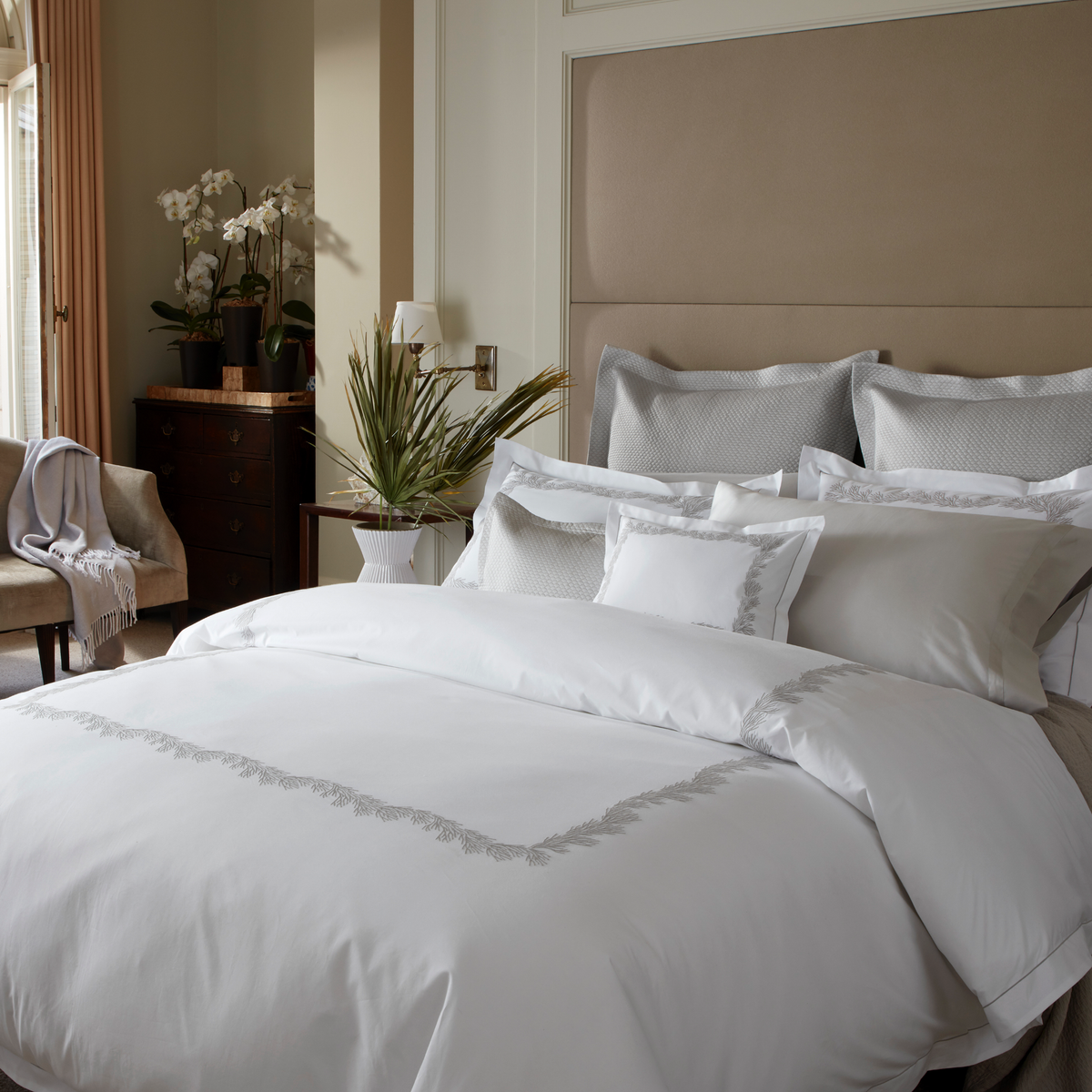 Full Lifestyle Image of Matouk Atoll Bedding Collection Alabaster Color