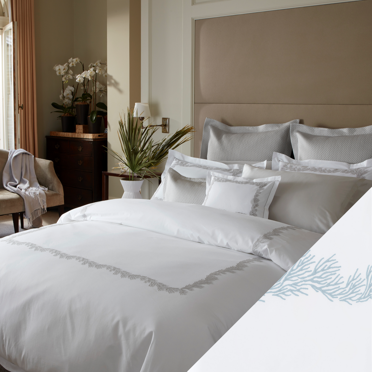 Full Lifestyle Image of Matouk Atoll Bedding Collection with Swatch of Wedgewood